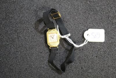 a watch that is laying on the ground next to a tag