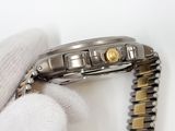 a watch that is being held by someone ' s hand