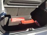 a trunk of a car with two batteries in it