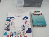 two books and a glass of water on a table