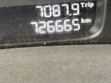 a close up of a digital clock on a car ' s dashboard