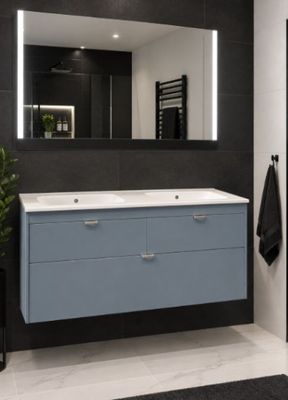 a bathroom with a sink and a mirror in it