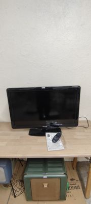 a computer desk with two monitors on top of it