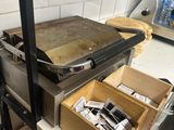 a pan on a shelf in a kitchen next to a stove