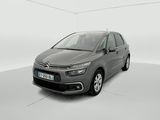 Une Citroën grise est garée dans une pièce blanche