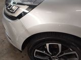 a close up of a white car with chrome rims