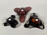 three glass figurines of a bull and a bear