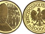 a close up of a gold coin with a pope on it