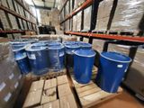 many blue barrels sitting on a pallet in a warehouse