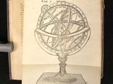 an open book with a drawing of a sundialer on top of it