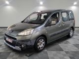 a picture of a small grey van parked in a garage