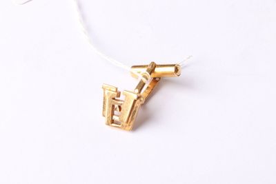 a close up of a gold plated necklace on a white background