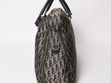 a black and white leopard print bag on a white background
