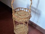 a wicker basket on a shelf next to a wall