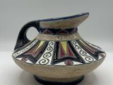 a picture of a vase with a decorative design on it