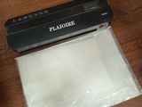 a vacuumr that is sitting on a table next to a bag