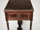 an old wooden table with a drawer on top of it