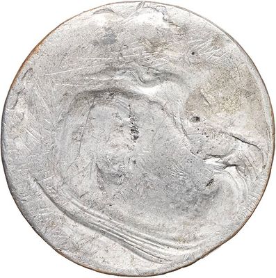 a close up of a silver coin with a bird on it