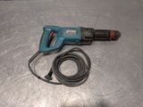 a cord that is connected to a drill on a table