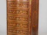 an antique wooden chest of drawers with ornate carvings on the drawers