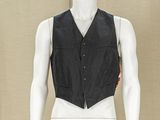 a mannequin wearing a black vest with red patches on it