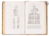 an open book with a drawing of a man on a horse on top of a table