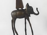 bronze statue of a horse with a hat on its head