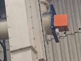 an orange box attached to the side of a building