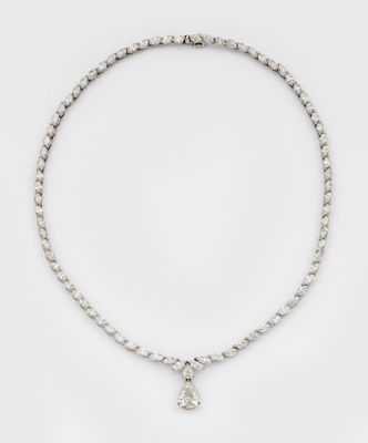 a diamond and white gold necklace with a tear shaped pendant