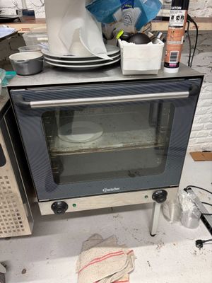 a toaster oven sitting on top of a counter in a kitchen