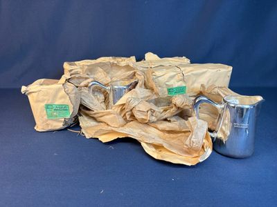 a pile of bags and cups on a blue background