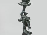 an image of a statue of a bird on top of a tree
