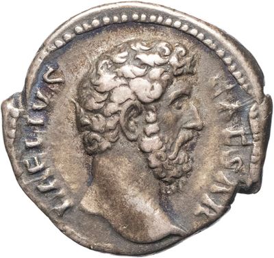 une pièce d'argent portant une tête d'homme