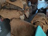 a room with a lot of bags of stuff on the floor