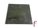 a close up of a book with a black cover on a white background