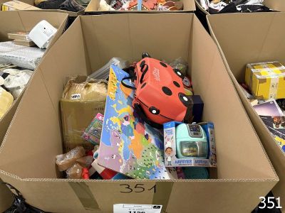 a cardboard box filled with assorted items in a store