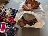 a pile of luggage sitting on the floor next to pallets