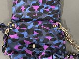 a blue and purple camouflage purse with a chain strap