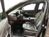the interior of a car with the door open and the driver ' s seat up