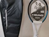 a tennis racquet and a bag on a table