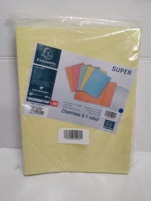 a pile of yellow sheets of paper sitting on top of a counter
