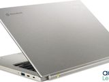 the laptop is open on a white surface with a logo on the screen