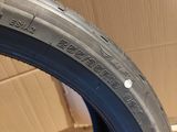 a close up of a tire on a cardboard box in a room