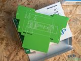 a box with a green electronic device inside of it