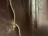 the inside of a black purse with a zipper on it