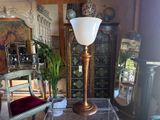 a table with a lamp on top of it in a living room