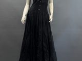 an image of a mannequin wearing a black dress on a mannequin stand