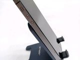 a close up of a cell phone on a stand