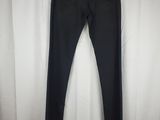 a pair of black pants hanging on a white curtain