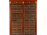 a large wooden cabinet with many drawers and drawers on top